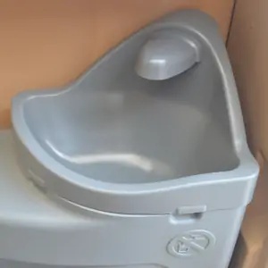 Gray sink inside a double towable restroom unit for events in Rancho Cordova, CA 