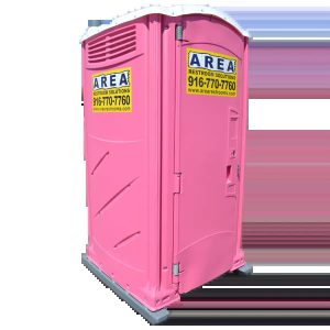 A Pink-Colored Portable Restroom Unit on a Gravel Lot for Temporary Rental Use in Rancho Cordova, CA